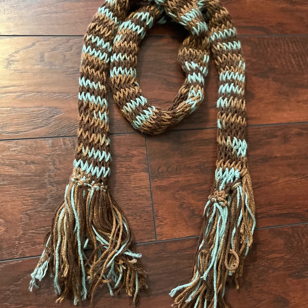 Homemade yarn scarf. Brown and teal with fringe.